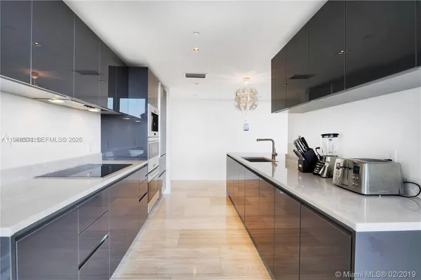 a kitchen with counter top space and cabinets