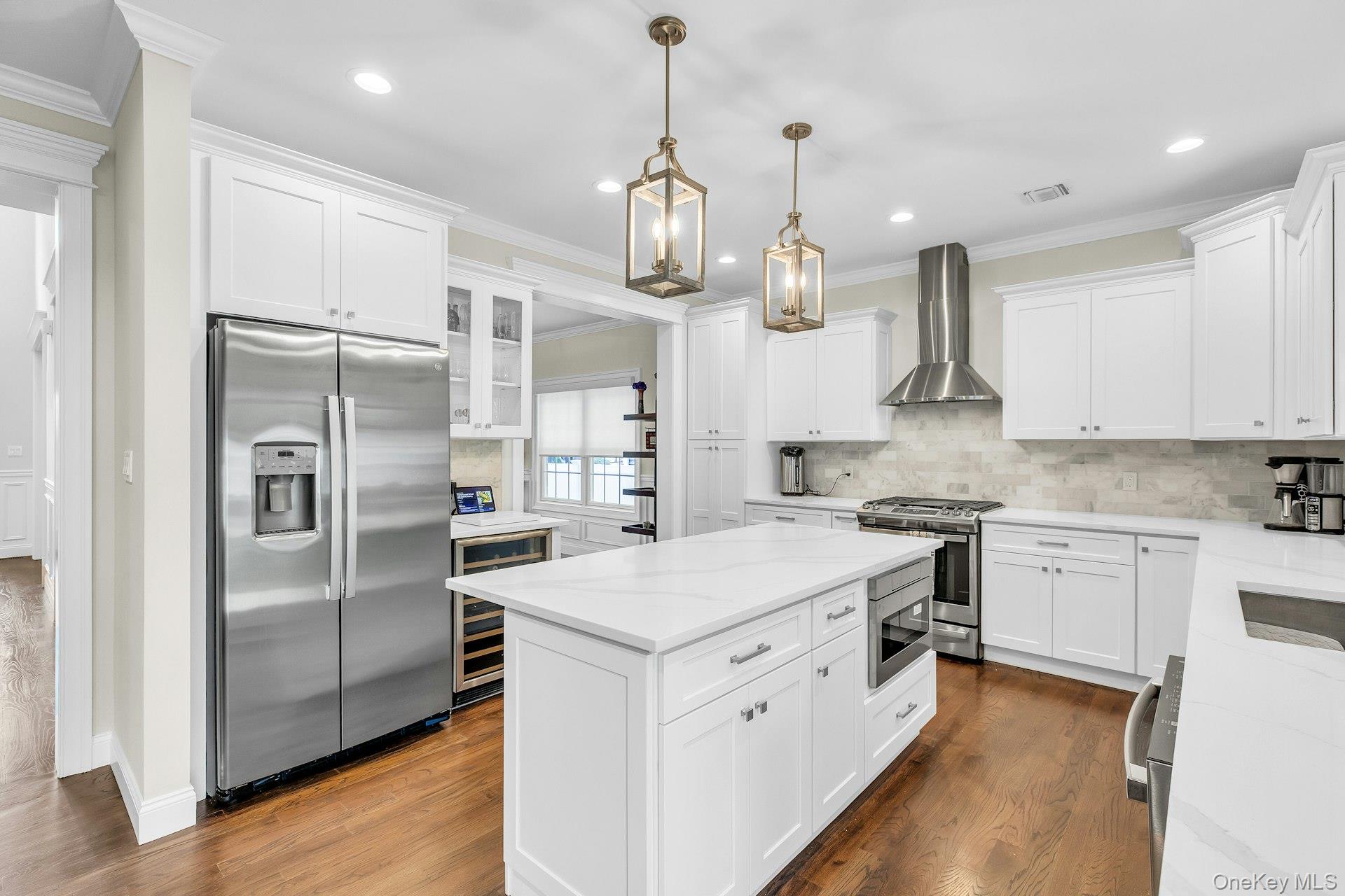 9 Hickory Road Bayville, NY 11709 - Photo 6 of 30 Quartz counter tops and back splash, two pendulum lights over the large custom Island, built in microwave