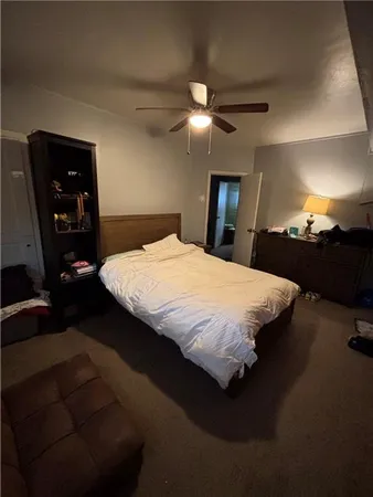 a bedroom with a bed and a closet