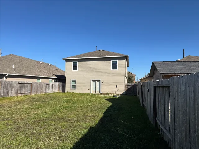 a house view with a backyard space