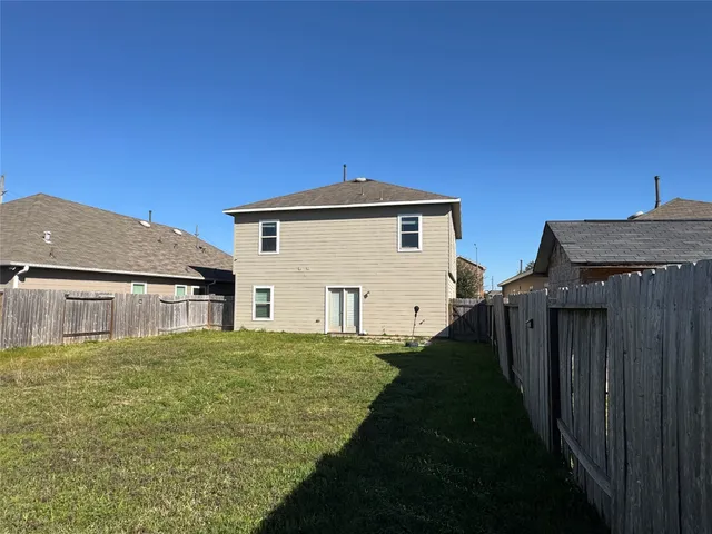 a house view with a backyard space