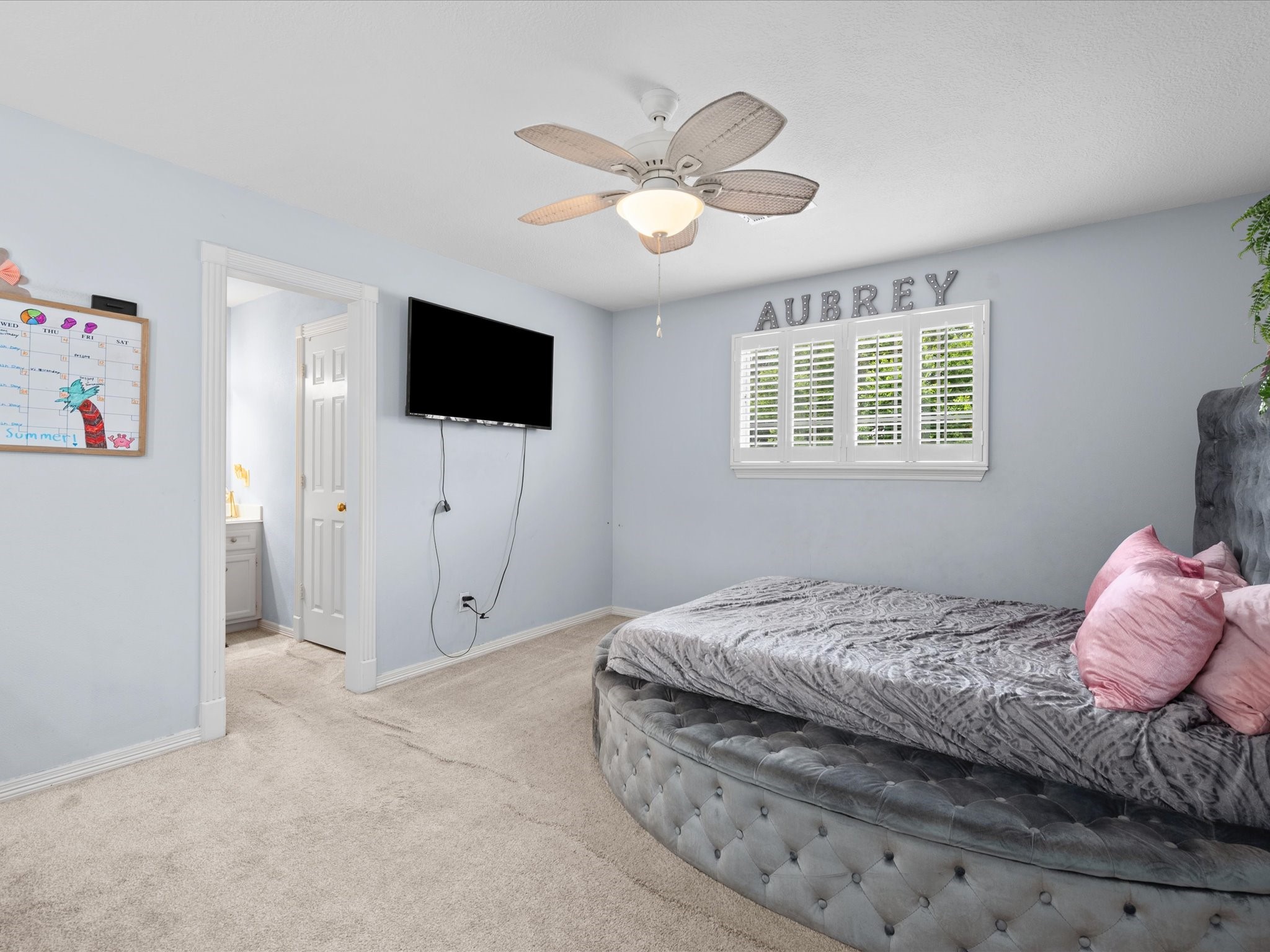 16123 Lafone Drive Spring, TX 77379 - Photo 31 of 47 Spacious and inviting, this secondary bedroom also enjoys direct access to the well-designed Jack-and-Jill bath, creating a comfortable and practical retreat.