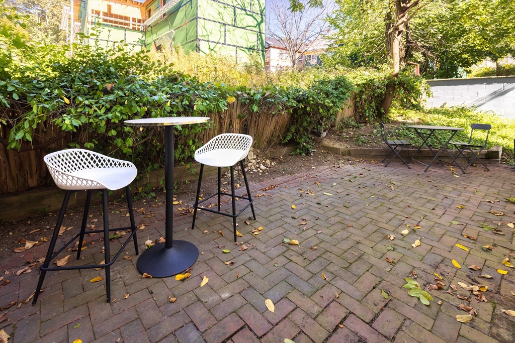 9 Carver Street Somerville, MA 02143 - Photo 11 of 11 a view of a chairs and table in backyard