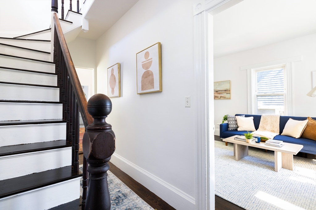 9 Carver Street Somerville, MA 02143 - Photo 2 of 11 a reading room with furniture and stairs