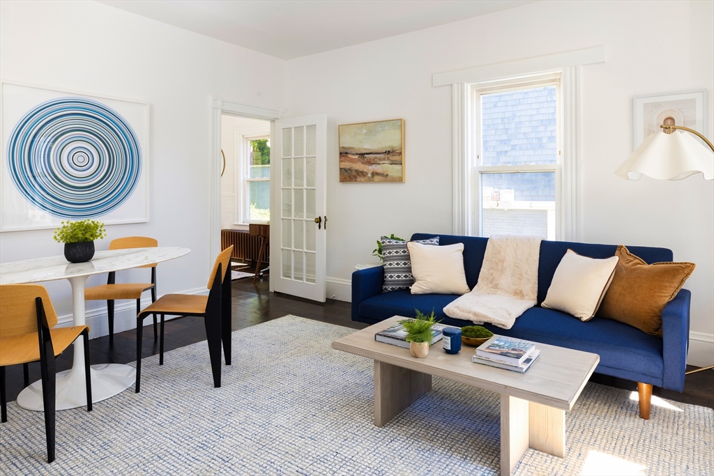 9 Carver Street Somerville, MA 02143 - Photo 3 of 11 a living room with furniture and a wooden floor