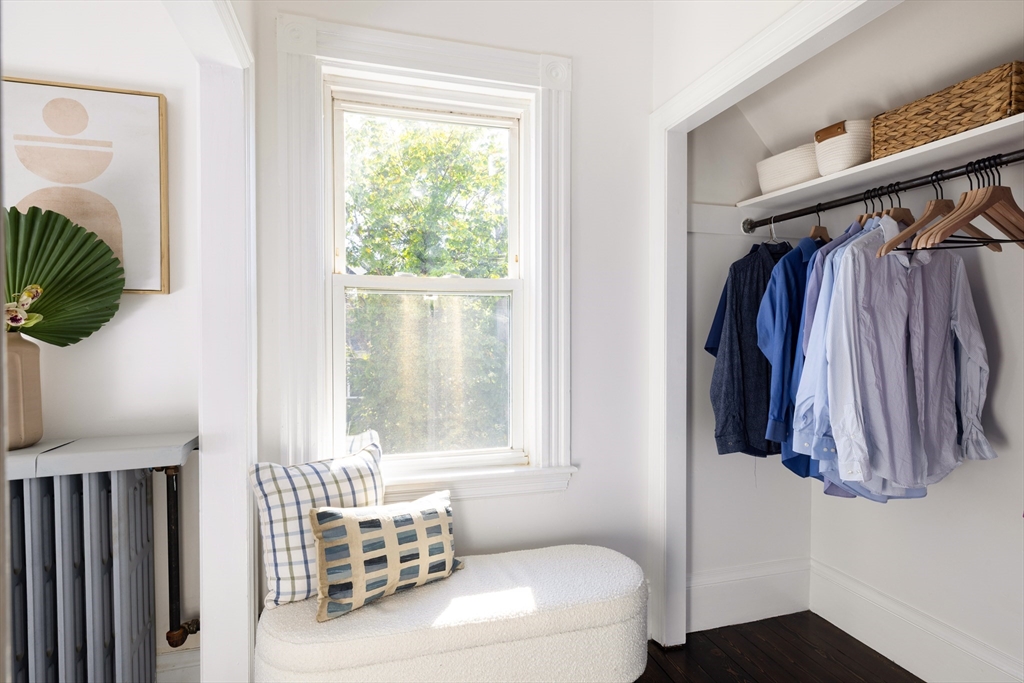 9 Carver Street Somerville, MA 02143 - Photo 7 of 11 a bedroom with a bed and a window