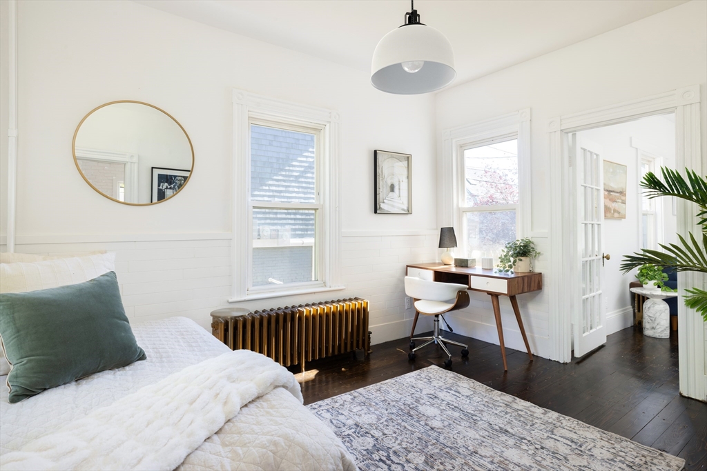 9 Carver Street Somerville, MA 02143 - Photo 10 of 11 a bedroom with furniture and a window