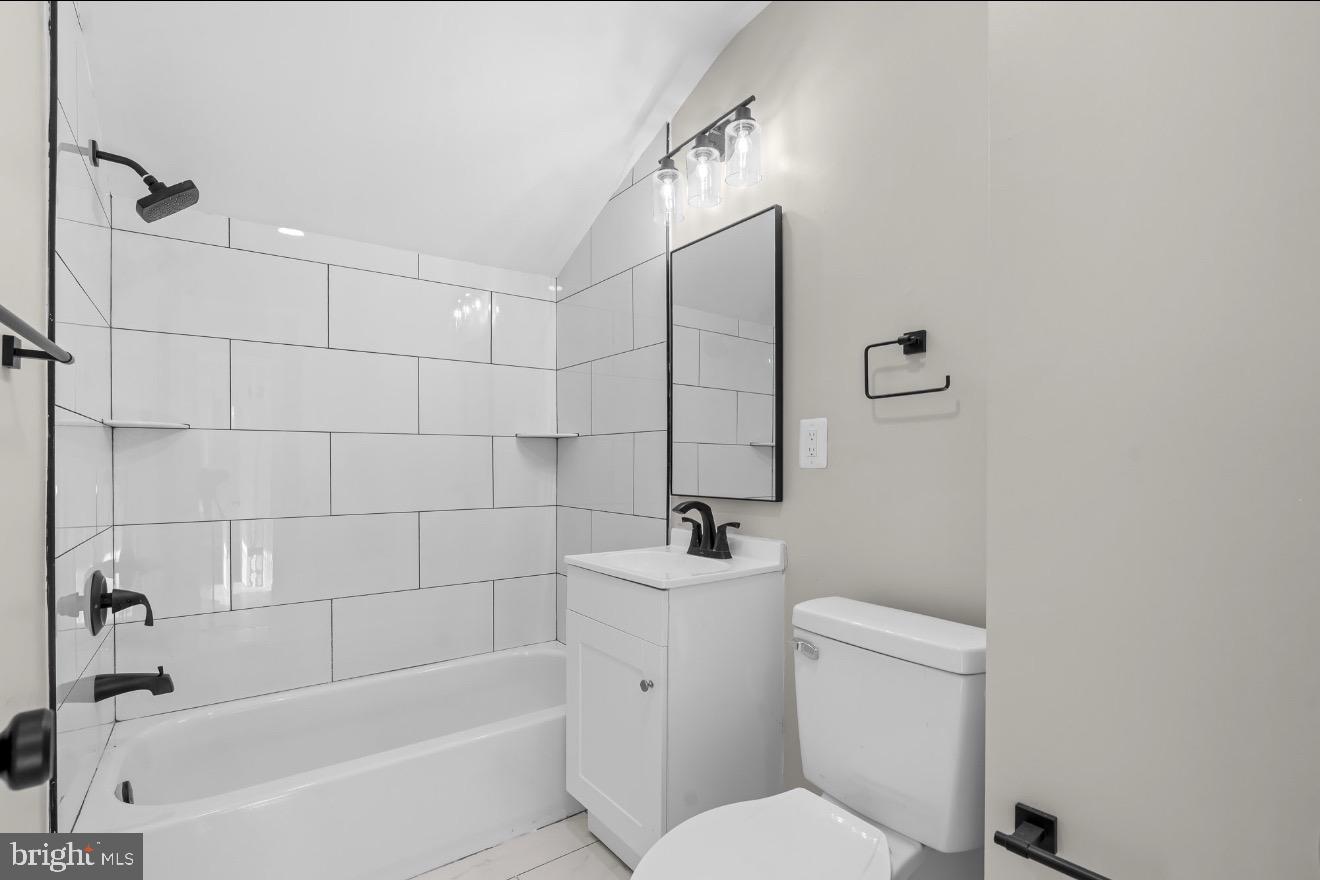 852 50th Place Northeast Washington, DC 20019 - Photo 6 of 15 Modern bathroom with sleek design elements.