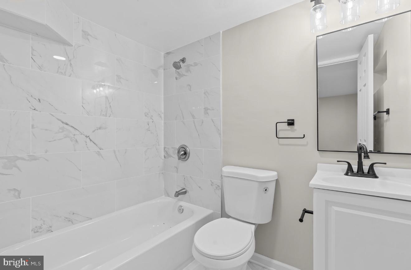 852 50th Place Northeast Washington, DC 20019 - Photo 9 of 15 Modern bathroom with elegant marble accents.