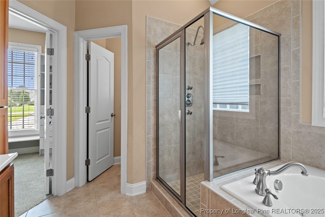 259 Rolling Pines Drive Spring Lake, NC 28390 - Photo 16 of 50 a bathroom with a sink and shower