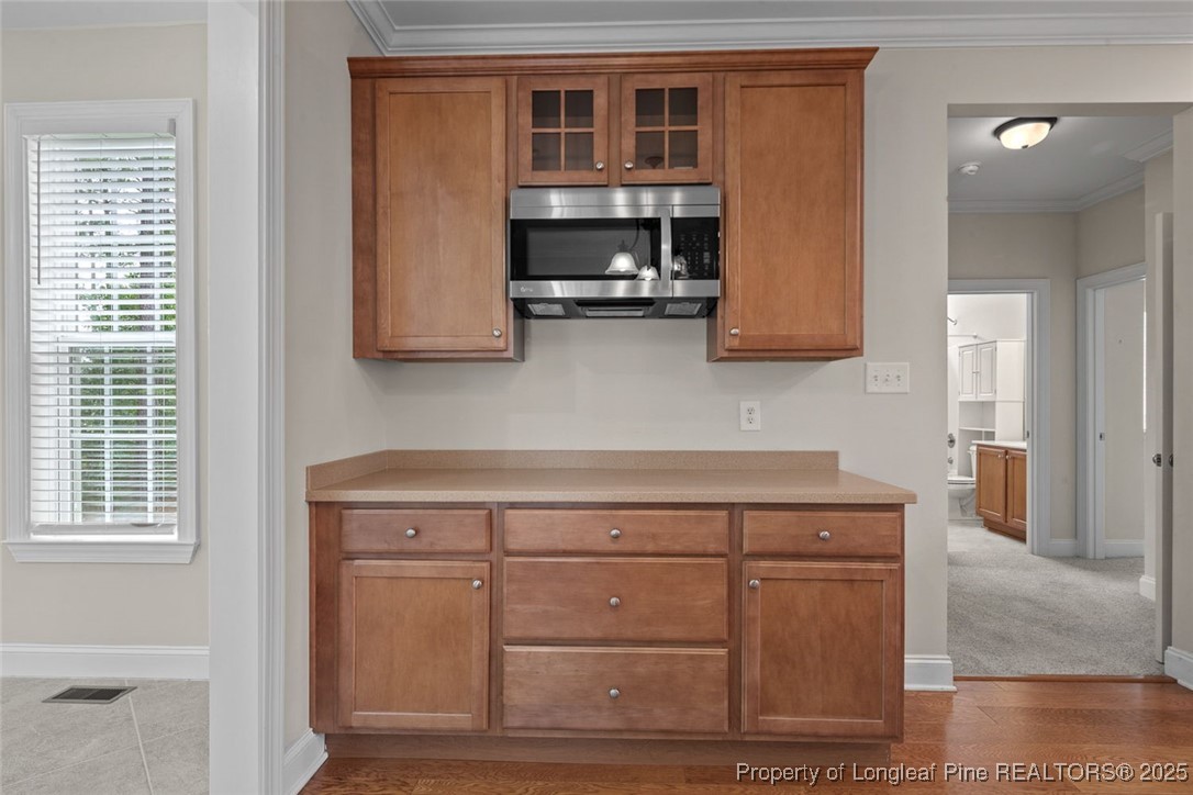 259 Rolling Pines Drive Spring Lake, NC 28390 - Photo 23 of 50 a kitchen with a cabinets and window