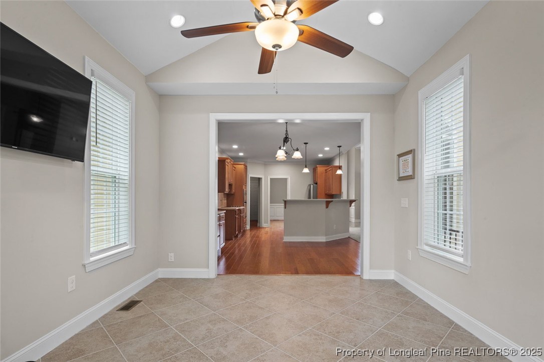 259 Rolling Pines Drive Spring Lake, NC 28390 - Photo 26 of 50 wooden floor in an empty room with a window