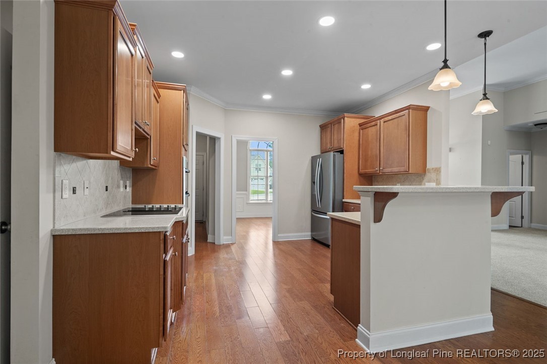259 Rolling Pines Drive Spring Lake, NC 28390 - Photo 28 of 50 a kitchen with stainless steel appliances granite countertop a refrigerator a stove top oven a sink and a refrigerator