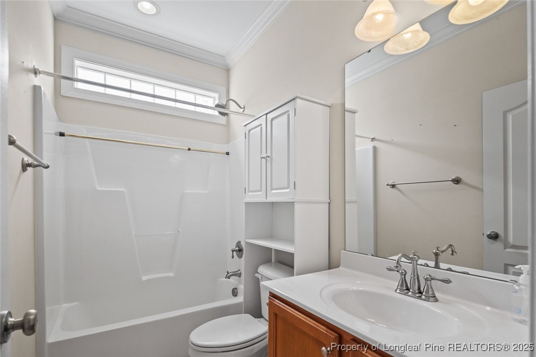 259 Rolling Pines Drive Spring Lake, NC 28390 - Photo 33 of 50 a bathroom with a sink toilet and shower