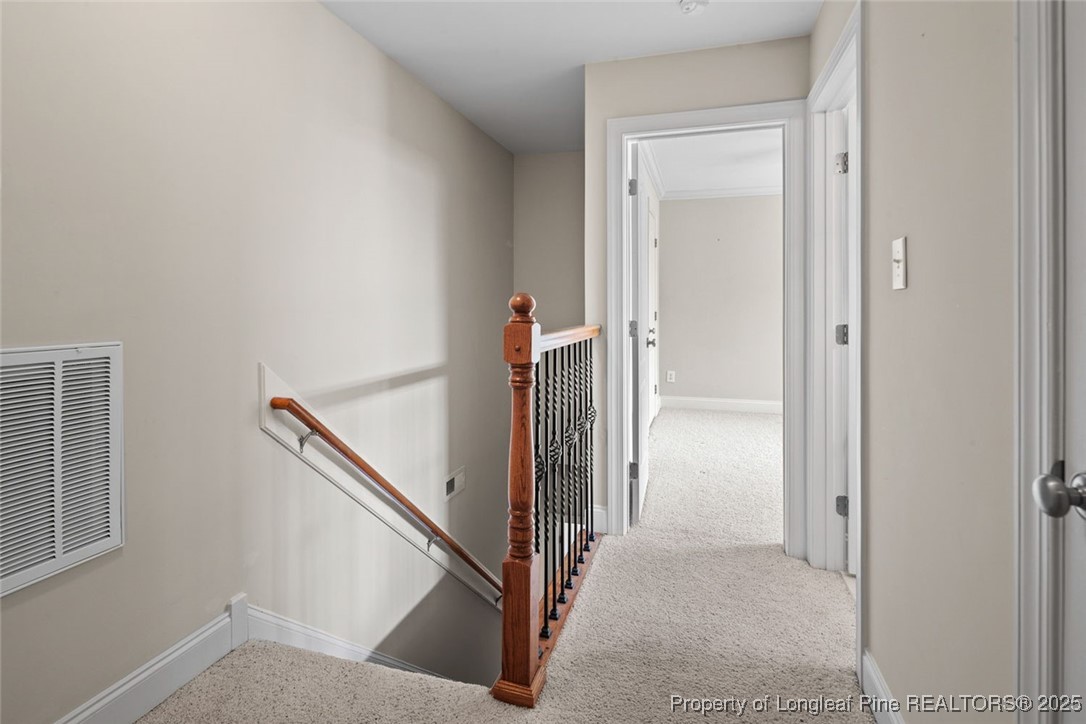 259 Rolling Pines Drive Spring Lake, NC 28390 - Photo 39 of 50 a view of a hallway with staircase