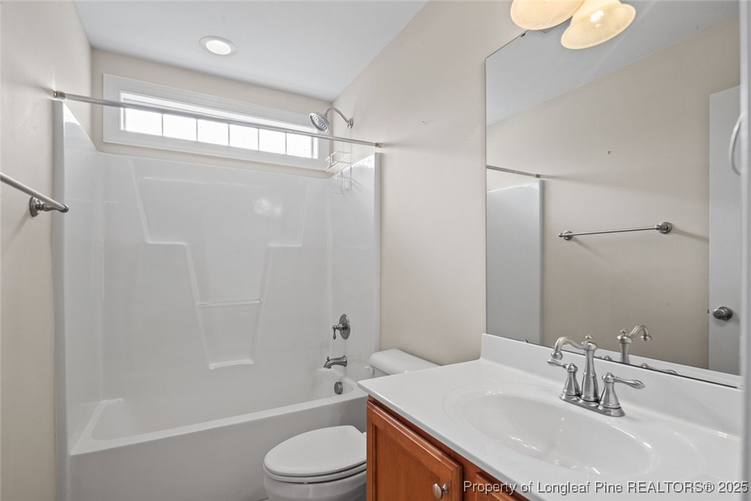 259 Rolling Pines Drive Spring Lake, NC 28390 - Photo 43 of 50 a bathroom with a sink a toilet and shower