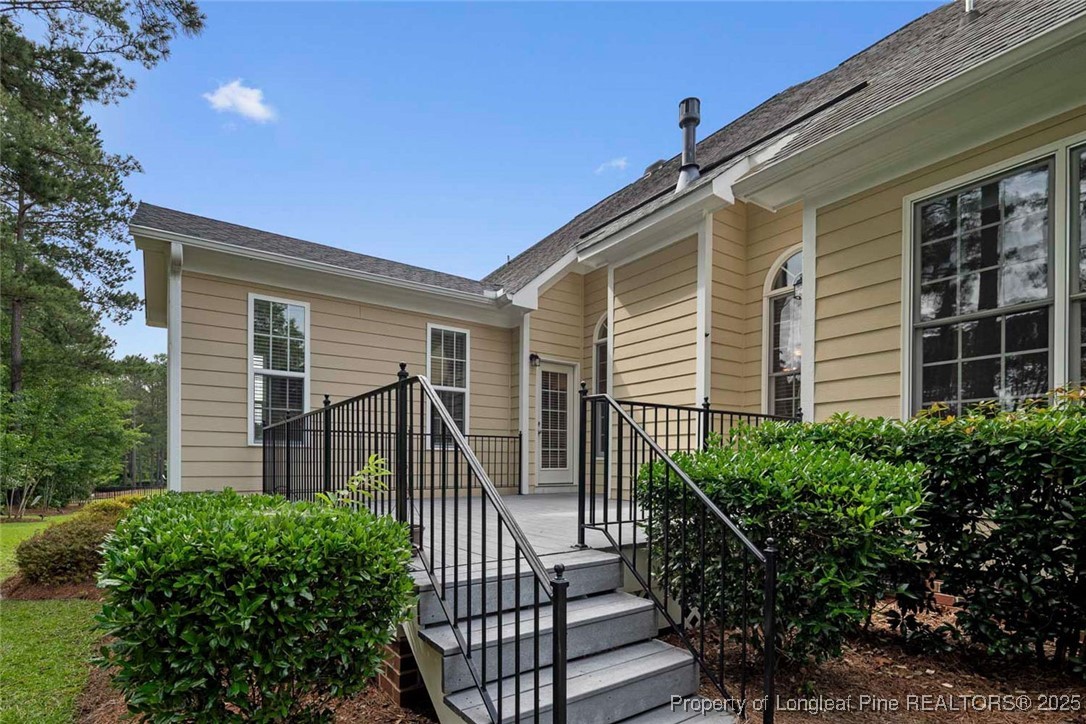 259 Rolling Pines Drive Spring Lake, NC 28390 - Photo 48 of 50 a view of a house with wooden fence and potted plants