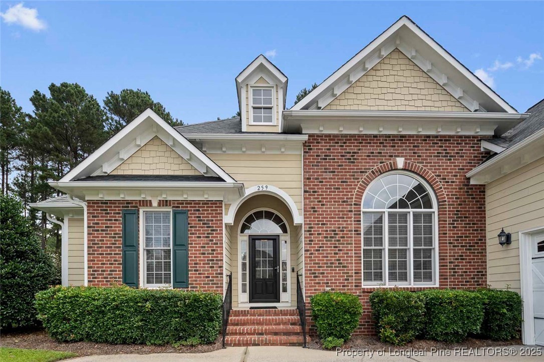 259 Rolling Pines Drive Spring Lake, NC 28390 - Photo 7 of 50 a front view of a house with garden
