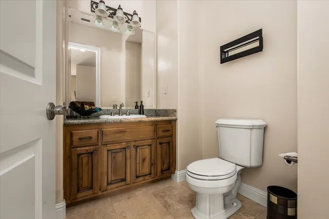 a living room with fireplace furniture and a chandelier