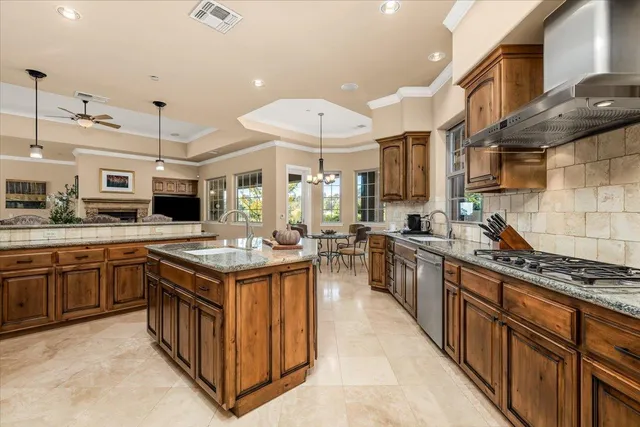 a view of a dining room with furniture and a chandelier