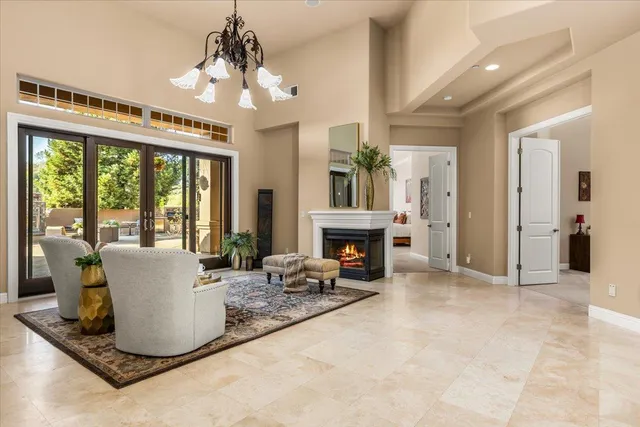 a living room with a window and a table