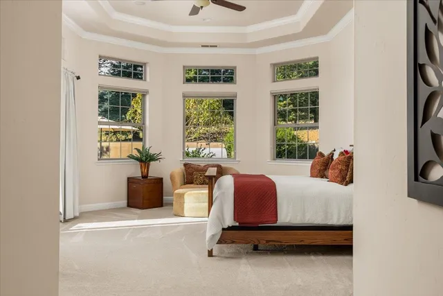 a bedroom with a bed and flat screen tv