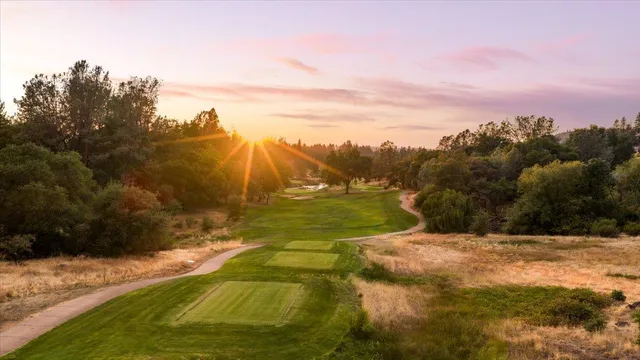 a view of a swimming pool with a yard