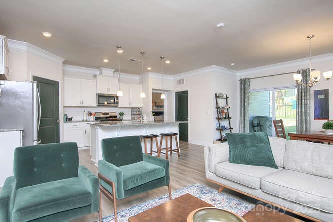 4245 Millstream Road Denver, NC 28037 - Photo 17 of 47 a living room with furniture kitchen and a table