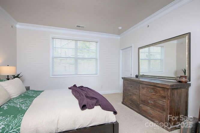4245 Millstream Road Denver, NC 28037 - Photo 23 of 47 a spacious bedroom with a bed and window