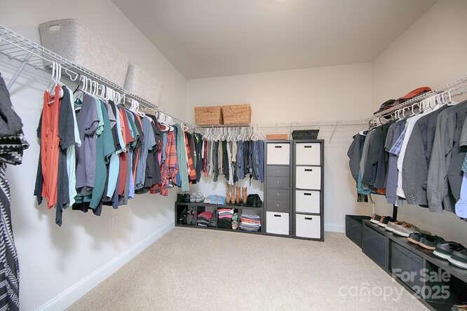 4245 Millstream Road Denver, NC 28037 - Photo 24 of 47 a view of walk in closet with clothes