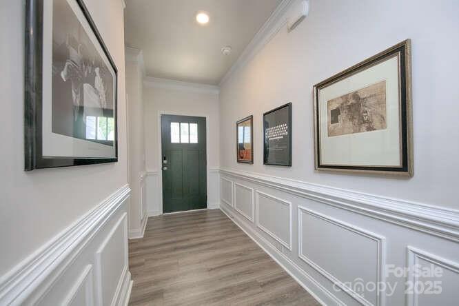 4245 Millstream Road Denver, NC 28037 - Photo 3 of 47 a view of a hallway with wooden floor and staircase