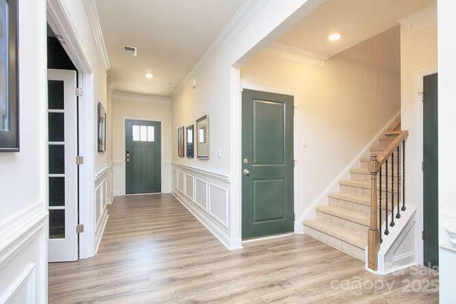 4245 Millstream Road Denver, NC 28037 - Photo 36 of 47 a view of a hallway with wooden floor and entryway