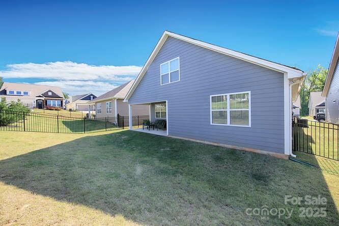4245 Millstream Road Denver, NC 28037 - Photo 45 of 47 a view of a house with a backyard