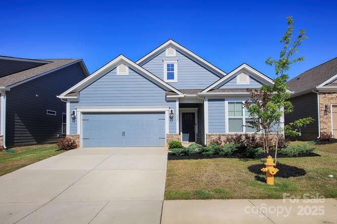 4245 Millstream Road Denver, NC 28037 - Photo 46 of 47 a front view of a house with garden