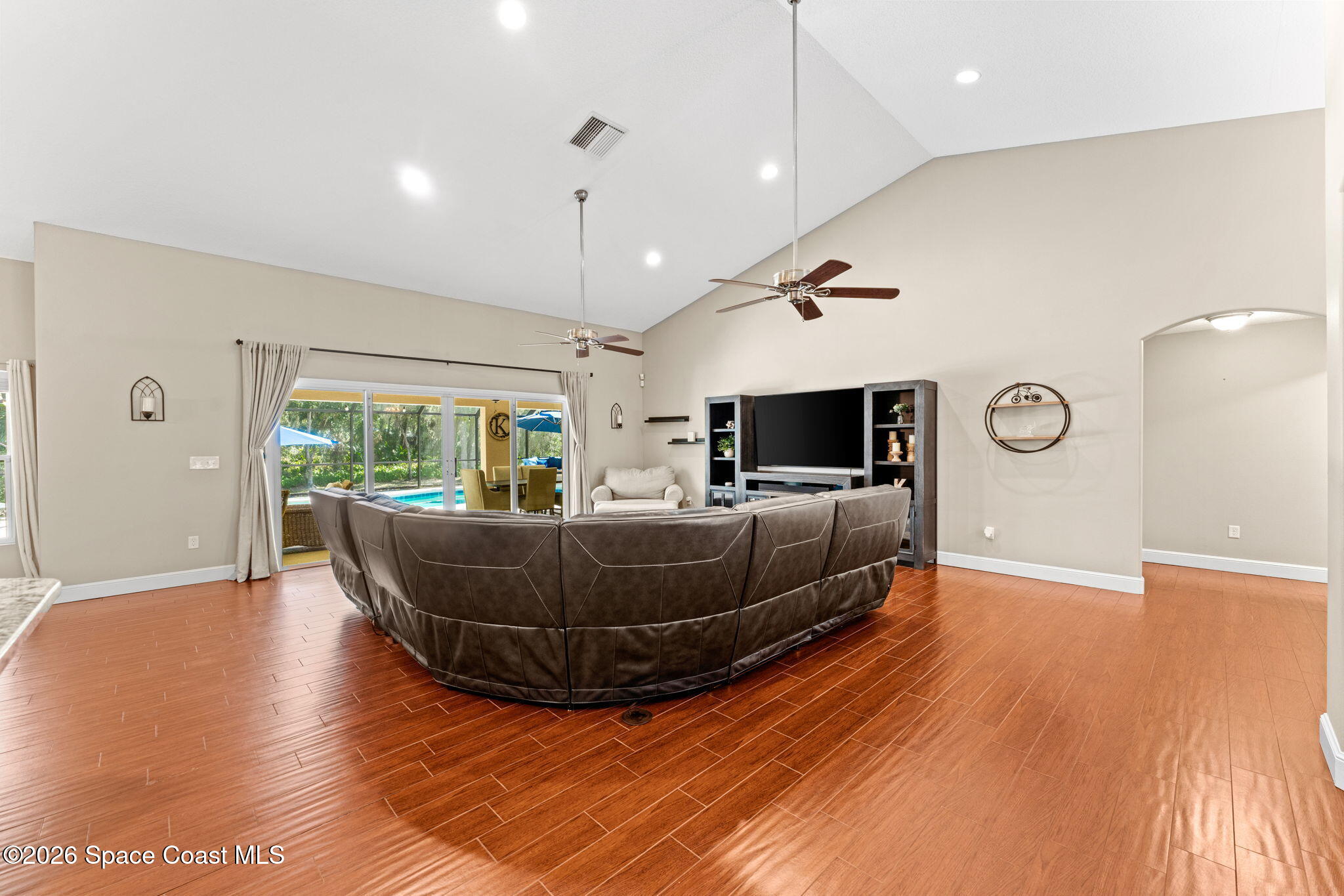 1695 Arch Road Mims, FL 32754 - Photo 12 of 57 a living room with furniture and a flat screen tv