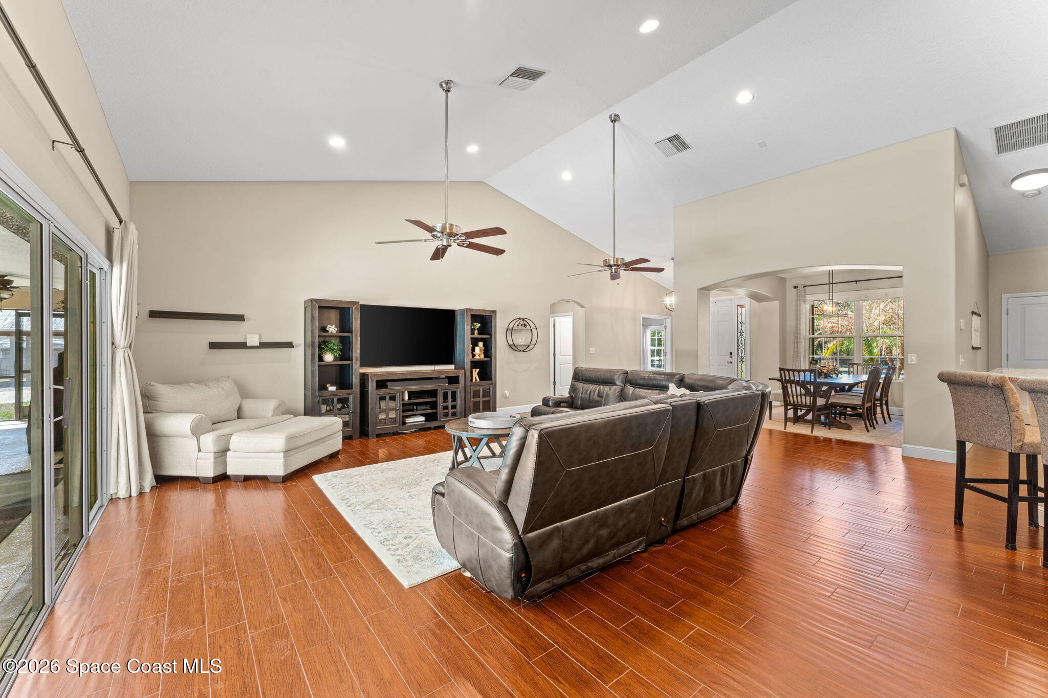 1695 Arch Road Mims, FL 32754 - Photo 16 of 57 a living room with furniture and a flat screen tv