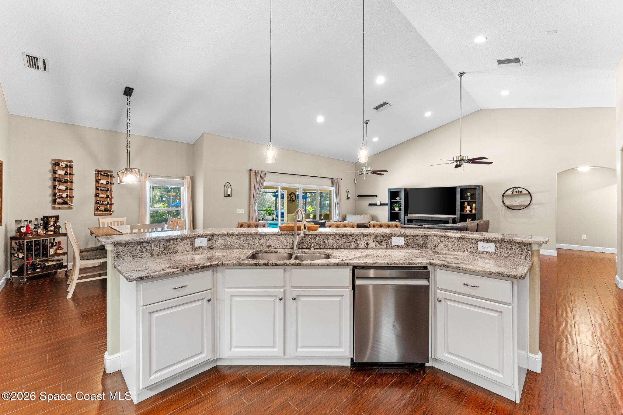 1695 Arch Road Mims, FL 32754 - Photo 20 of 57 a kitchen with a sink stove and cabinets