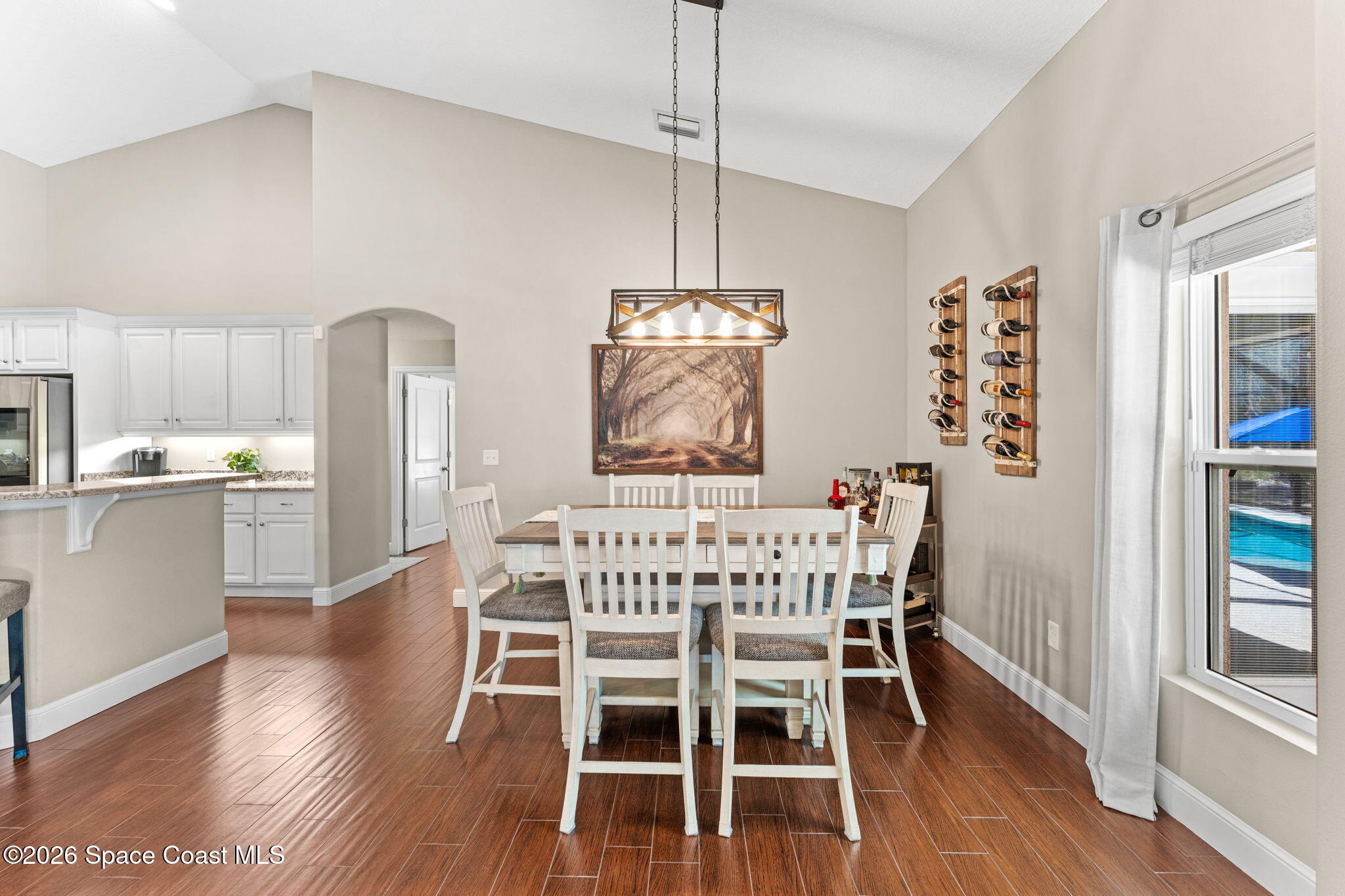 1695 Arch Road Mims, FL 32754 - Photo 21 of 57 a view of a dining room with furniture window and wooden floor