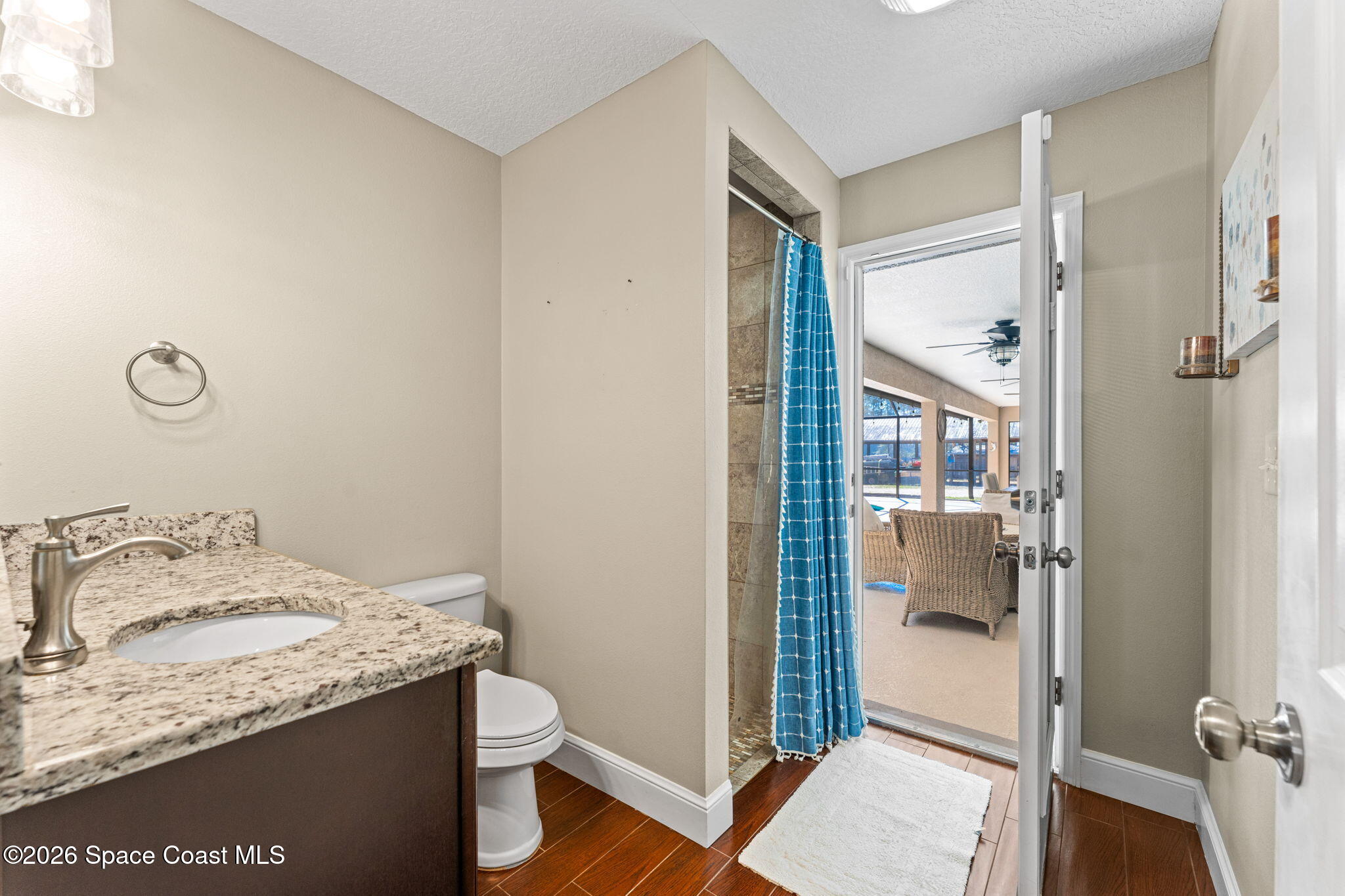 1695 Arch Road Mims, FL 32754 - Photo 30 of 57 a bathroom with a granite countertop sink and a mirror