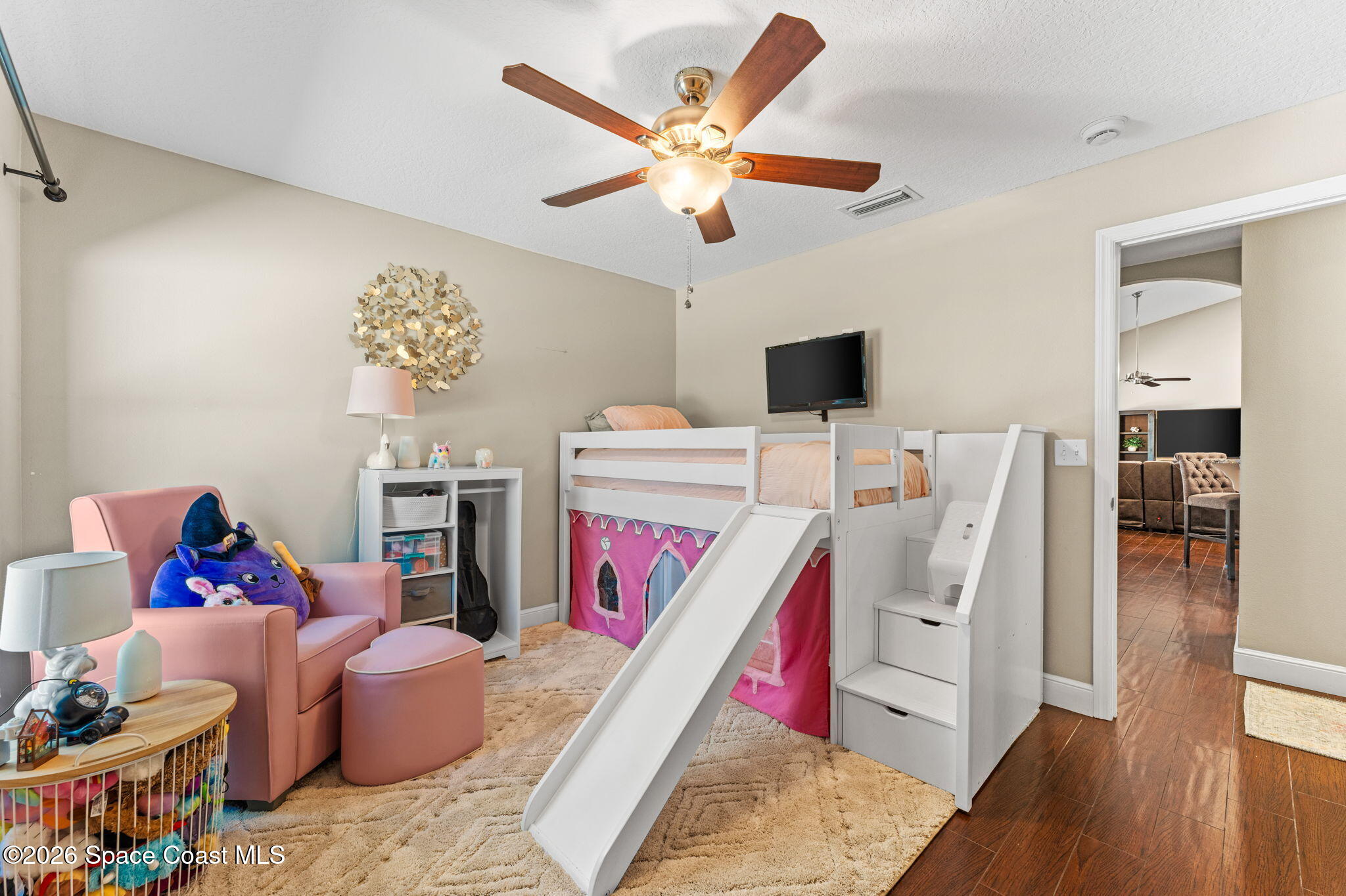 1695 Arch Road Mims, FL 32754 - Photo 31 of 57 a bed room with a bed and a couch