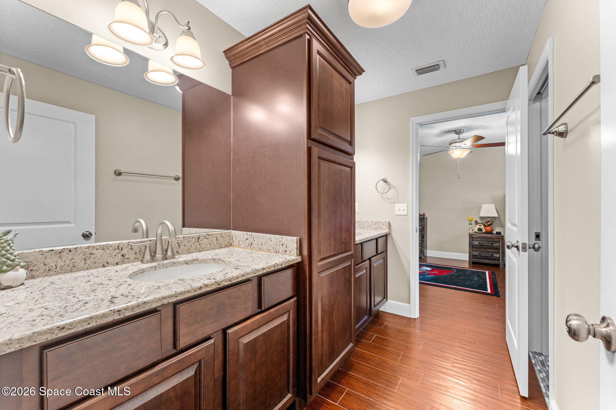 1695 Arch Road Mims, FL 32754 - Photo 33 of 57 a bathroom with a sink and a mirror