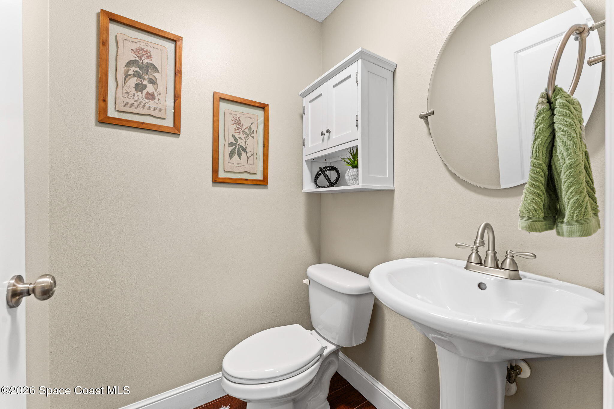 1695 Arch Road Mims, FL 32754 - Photo 39 of 57 a white toilet sitting next to a bathroom sink