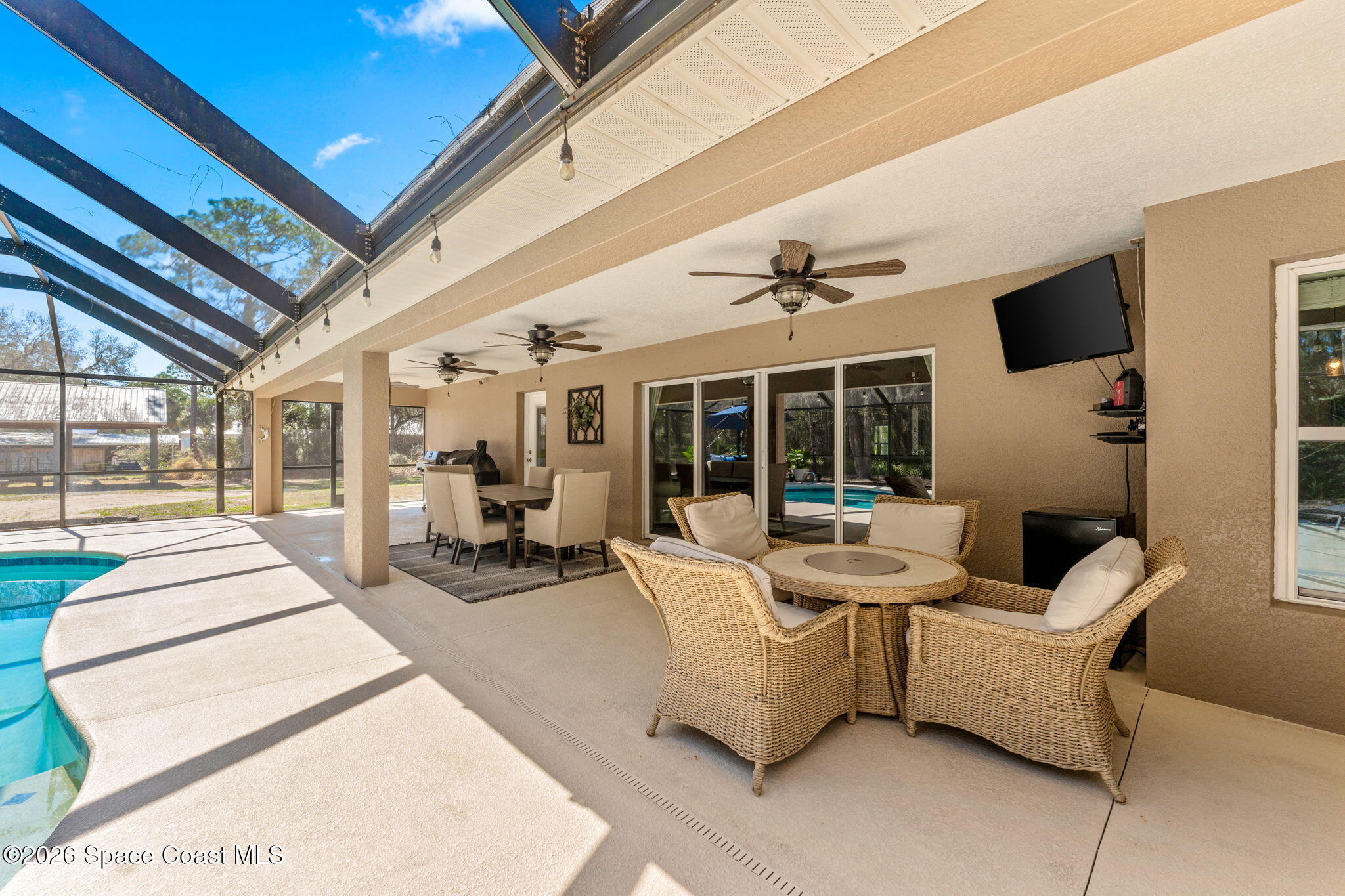 1695 Arch Road Mims, FL 32754 - Photo 43 of 57 a living room with furniture and large windows