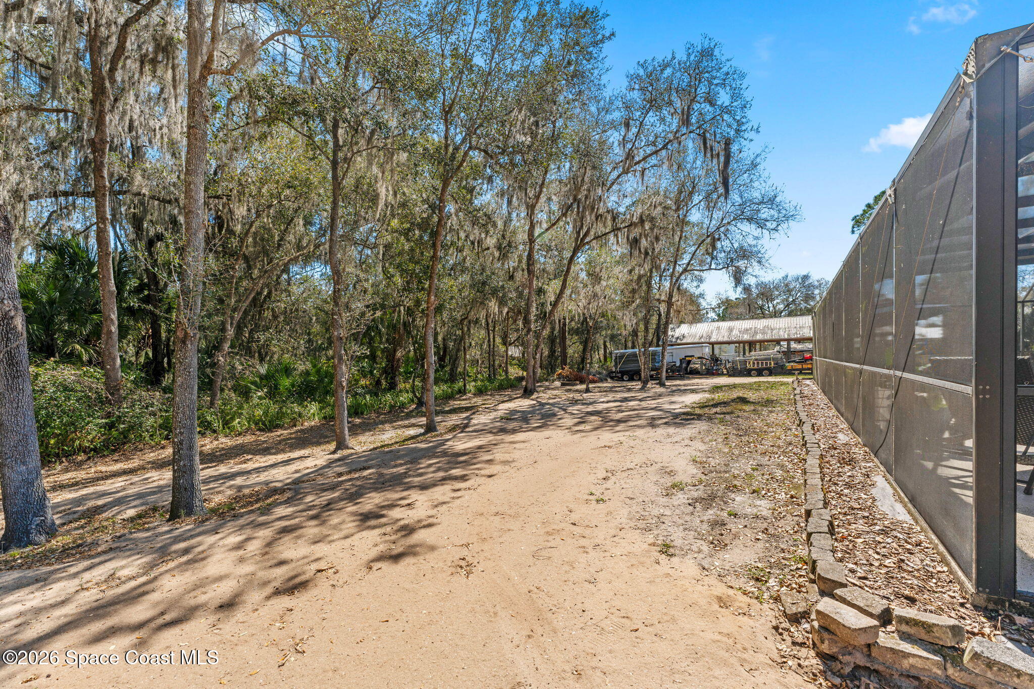 1695 Arch Road Mims, FL 32754 - Photo 49 of 57 a backyard of a house with wooden fence