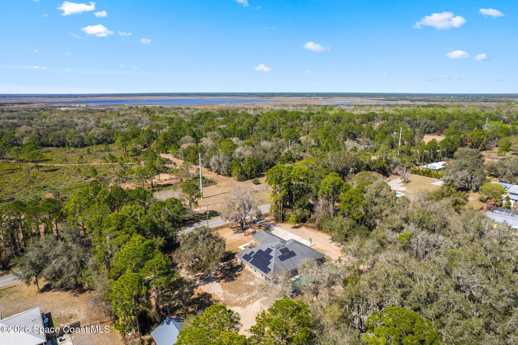 1695 Arch Road Mims, FL 32754 - Photo 54 of 57 an aerial view of residential houses with outdoor space and trees all around