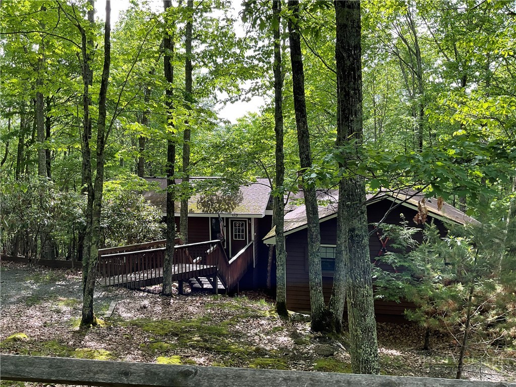 117 Rhododendron Drive Beech Mountain, NC 28604 - Photo 2 of 33 a view of a house with a yard and sitting area