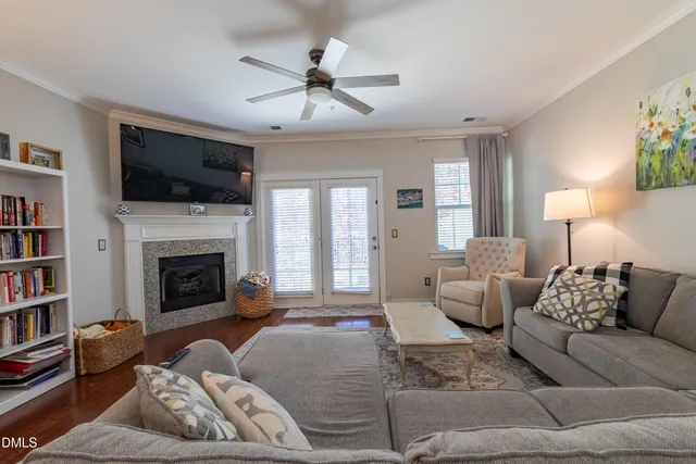 a living room with furniture fireplace and a flat screen tv