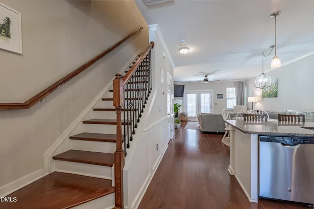 a view of entryway and hall with wooden floor