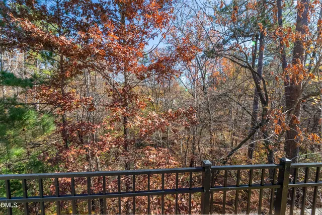 a view of a balcony with trees