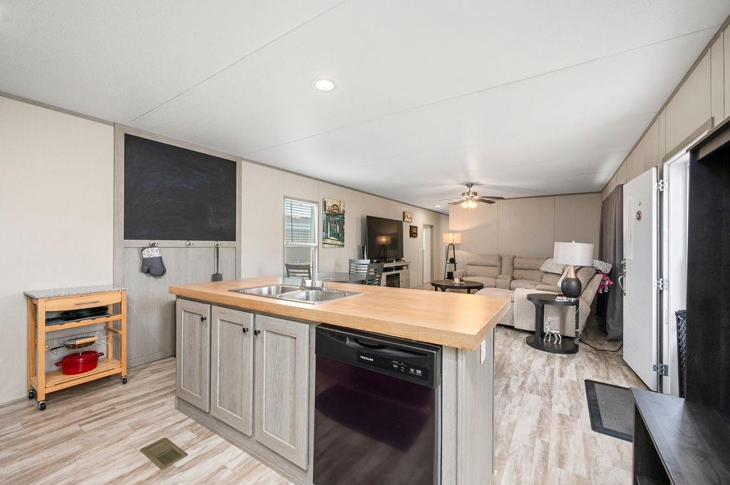 271 Clements Way Fruita, CO 81521 - Photo 9 of 26 a large kitchen with a lot of counter space and a sink